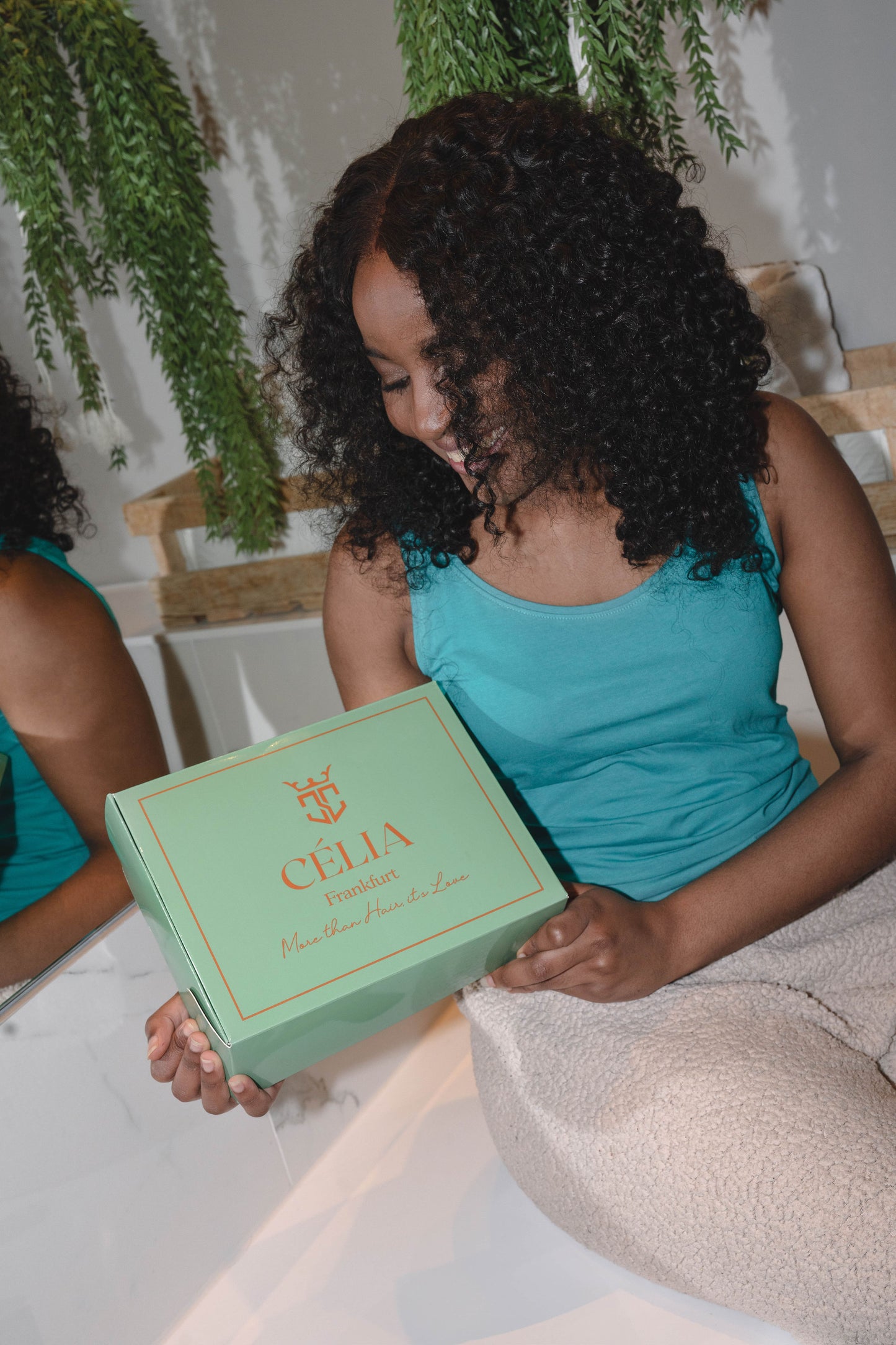 Adora wig featuring vibrant, kinky curly texture made from 100% human hair, offering a voluminous and natural look with bouncy curls. Available in a variety of shades for a personalized style.