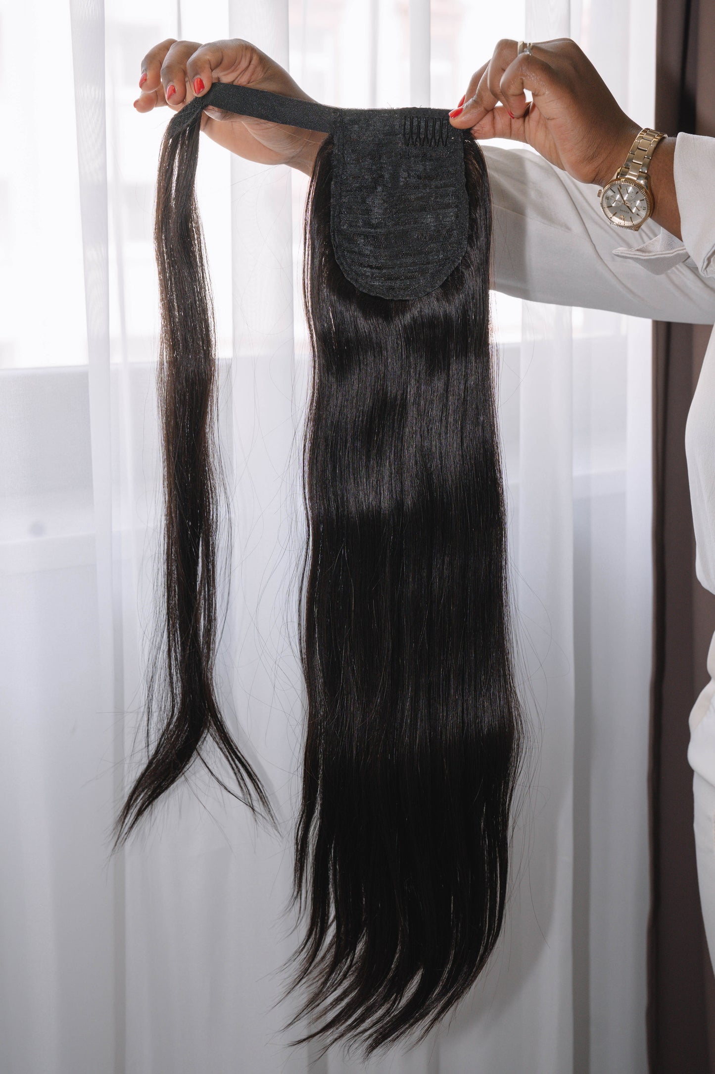 22-inch Bone Straight ponytail made of 100% raw human hair in natural black (Color 1B), sleek and silky texture, 100g